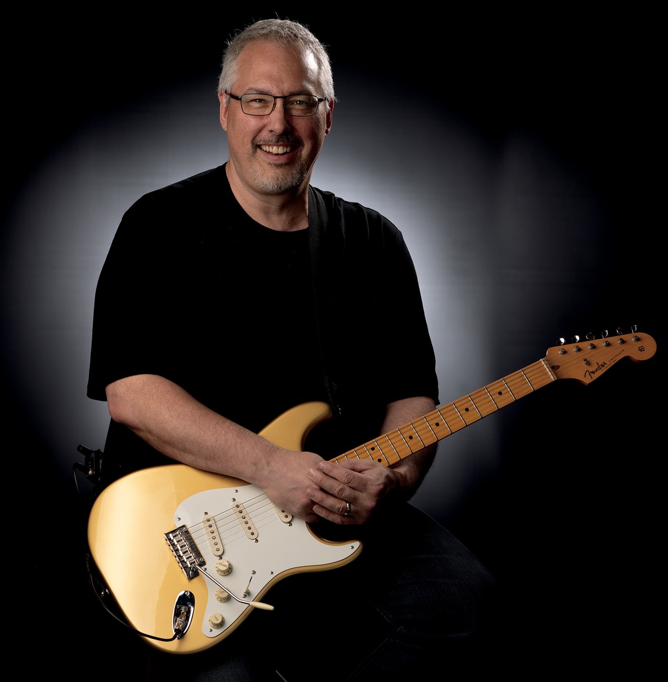 Jamie Penner holding a guitar
